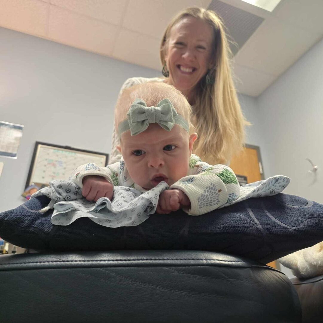 Dr. Brenda giving a baby a gentle chiropractic adjustment